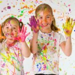 Children with a messy painting project